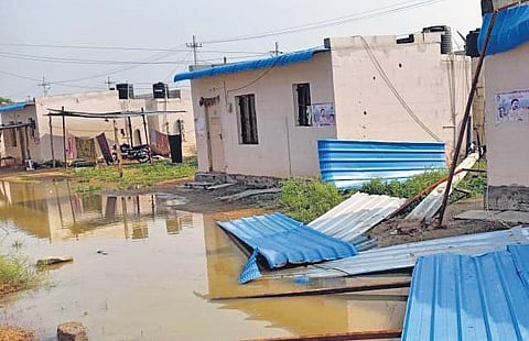 Asbestos sheets fall off a house at the R&R Colony in Tunki Bollaram, after rains