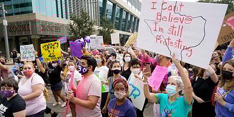 People participate in the Houston Women's March against Texas abortion ban walk from Discovery Green to City Hall in Houston. (Photo | AP)