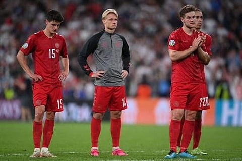 Denmark's players react to their defeat in the UEFA EURO 2020 semi-final football match between England and Denmark at Wembley Stadium in London on July 7, 2021 | AFP