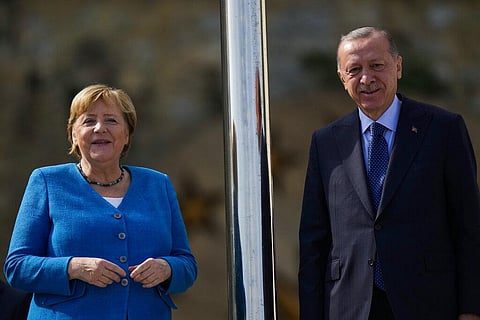German Chancellor Angela Merkel, left, is welcomed by Turkish President Recep Erdogan on occasion of their meeting at Huber Villa presidential palace, Istanbul, Turkey, Saturday. (Photo | AP)