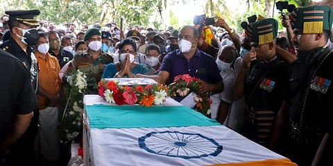 Family members of Sepoy Vaisakh H, who lost his life in Poonch (J&K) during an anti-terrorist operation, pay their last respects on his mortal remains before his last rites. (Photo | ANI)