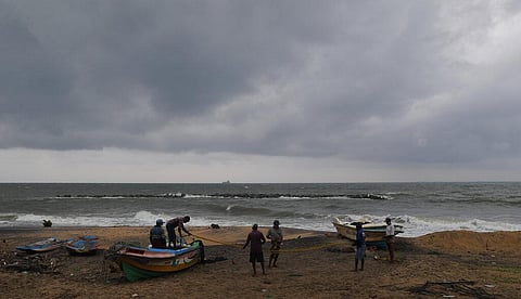 Sri Lankan fishermen arrange their accessories on the beach of Colombo. (Photo | AP)