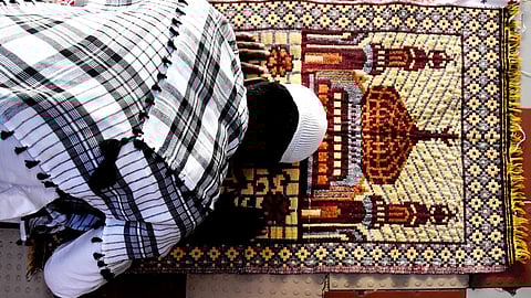 A man praying on the occasion of Eid.