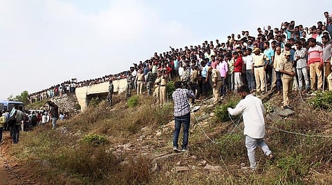 People raise slogans in favour of police at the encounter site, where four accused in the rape-and-murder case were killed in an exchange of fire with police. (File | PTI)