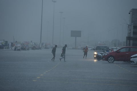 People stuck in heavy downpour as heavy rains lashed Marina Beach in Chennai earlier in the week. (Photo | R Satish Babu, EPS)