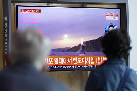 People watch a TV screen showing a news program reporting about North Korea's missile launch with file footage at a train station in Seoul, South Korea, Tuesday, Oct. 19, 2021. (Photo | AP)
