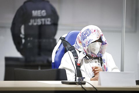 The 96-year-old defendant Irmgard F. sits in an ambulance chair behind a plexiglass screen in a courtroom in Itzehoe, Germany (Photo | AP)