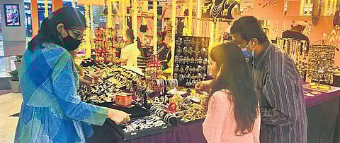 Shoppers at the Jahanara Jewels stall (above) and Varque stall (below) at Select Citywalk’s PopBox Diwali Edit, 2021