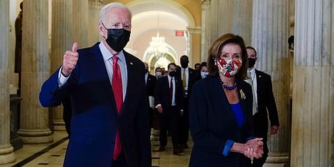 US President Joe Biden gives a thumbs up as he walks with House Speaker Nancy Pelosi of Calif., on Capitol Hill in Washington. (Photo | AP)