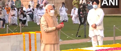 PM Narendra Modi pays tribute to Mahatma Gandhi at Raj Ghat. (Photo| ANI)