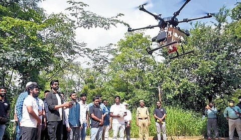 Tollywood actor Rana Daggubati flies a drone after inaugurating the Seedcopter initiative by Marut Drones, at KBR National Park in Hyderabad on Friday | RVK Rao