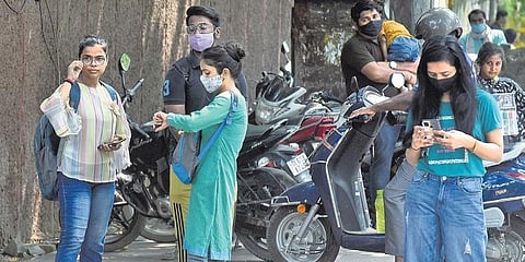 Students wait outside Delhi University as first cut-off list for undergraduate admission was released on Firday. (Photo | Parveen Negi, EPS)