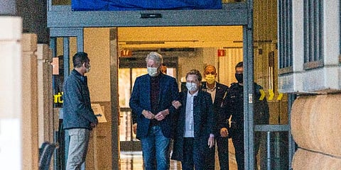 Former President Bill Clinton and former U.S. Secretary of State Hillary Clinton leave the University of California Irvine Medical Center in Orange, California, Sunday, Oct. 17, 2021. (Photo | AP)