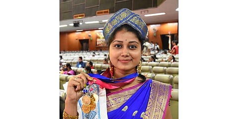 Narmada Behera shows her six gold medals at Sanskrit varsity convocation