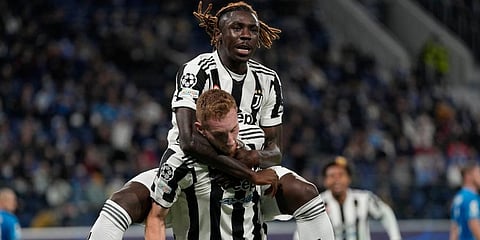 Juventus' Dejan Kulusevski (bottom) celebrates with Moise Kean after scoring. (Photo | AP)