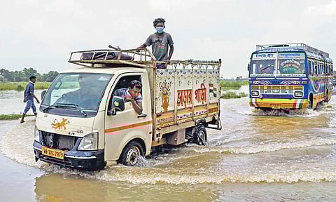 Vehicles on a flooded road in West Bengal’s Birbhum on Wednesday | PTI