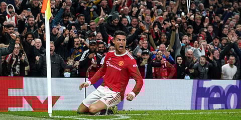Manchester United's Cristiano Ronaldo celebrates scoring his side's third goal during the Champions League match against Atalanta. (Photo | AP)