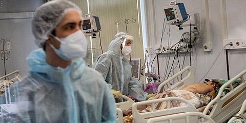 Medical staff in special suits treat a COVID-19 patient at an ICU in Infectious Hospital No. 23 in Nizhny Novgorod, Russia, on Wednesday, Oct. 20, 2021. (Photo | AP)