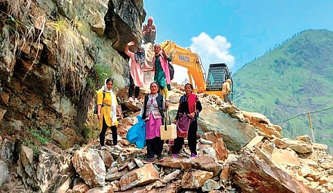 Health workers carrying vaccines on their way to Uttarkashi in Uttarakhand