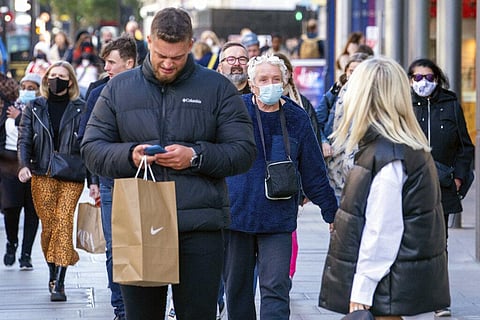 Shoppers walk on Oxford Street, London, England, Oct. 22, 2021. (Photo | AP)