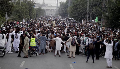 Supporters of Tehreek-e-Labiak Pakistan, a radical Islamist political party, march toward Islamabad, in Lahore, Pakistan, Friday, Oct. 22, 2021. (Photo | AP)