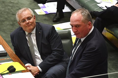 Australia PM Scott Morrison, left, listens to Deputy Prime Minister Barnaby Joyce during question time in Parliament House in Canberra. (Photo | AP)
