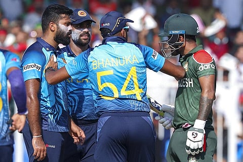Bangladesh's Liton Das, right, gestures to Sri Lankan bowler Lahiru Kumara, left, as Sri Lanka's Bhanuka Rajapaksa keeps them apart during the Cricket Twenty20 World Cup match. (Photo | AP)