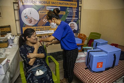 An Indian woman reacts as she gets inoculated against the coronavirus in Gauhati, India, Thursday, Oct. 21, 2021. (Photo | AP)