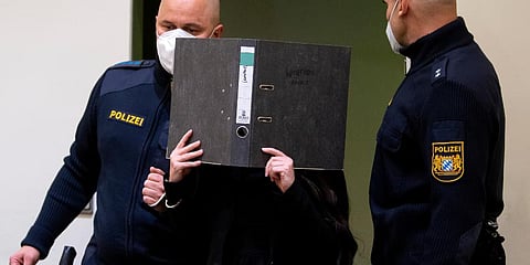 Defendant Jennifer W. arrives in a courtroom for her trial in Munich, Germany. (Photo | AP)