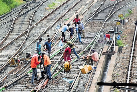 Workers repairing railway tracks. (File photo)