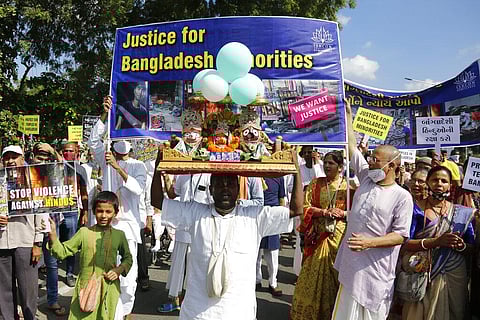Followers of the International Society for Krishna Consciousness (ISKCON) protest against the recent violence against Hindus in Bangladesh. (Photo | AP)