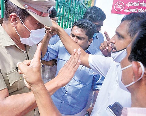 A Congress worker arguing with a policeman at the main gate of the corporation office in Thiruvananthapuram on Monday | Vincent Pulickal