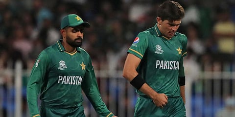 Pakistan's Shaheen Afridi (R) listens to captain Babar Azam during the T20 World Cup match against New Zealand in Sharjah. (Photo| AP)