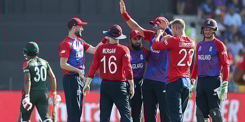 England players celebrate the dismissal of Bangladesh's captain Mohammad Mahmudullah, left, during their ICC T20 World Cup match in Abu Dhabi, UAE, Oct. 27, 2021. (Photo | AP)