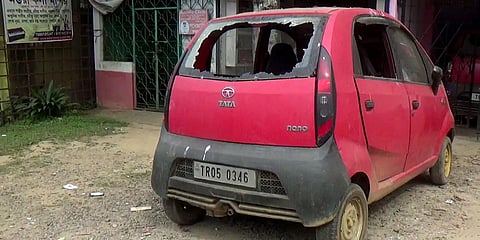 A car damaged in Tripura's North district after violence broke out followed by a VHP rally, in Dharmanagar. (Photo| ANI)