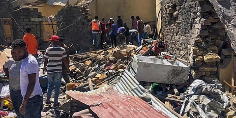 Residents sift through rubble from a destroyed building at the scene of an airstrike in Mekele, in the Tigray region of northern Ethiopia. (Photo | AP)