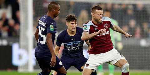 West Ham's Andriy Yarmolenko (R) duels for the ball with Manchester City's Fernandinho and Stones. (Photo | AP)