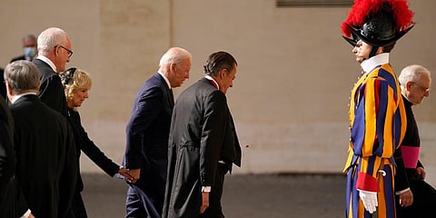 US President Joe Biden holds the hand of first lady Jill Biden as they arrive for a meeting with Pope Francis at the Vatican. (Photo | AP)