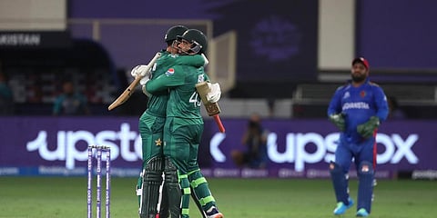 Pakistan's Asif Ali hugs teammate Shadab Khan to celebrate their win during a T20 World Cup match against Afghanistan in Dubai. (Photo| AP)