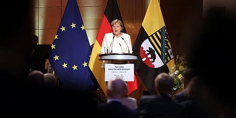 German Federal Chancellor Angela Merkel (CDU) speaks at the ceremony marking German Unity Day in the Handel Hall in Halle/Saale, Sunday, Oct. 3, 2021. (Photo | AP)