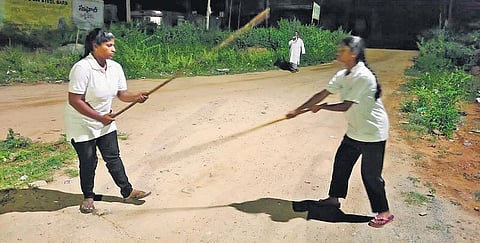 Varshita and her sister Akhila practise Silambam in Rayachoti. (Photo | Express)