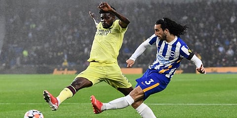 Arsenal's Thomas Partey (L) and Brighton and Hove Albion's Marc Cucurella in action during their English Premier League match. (Photo | AP)