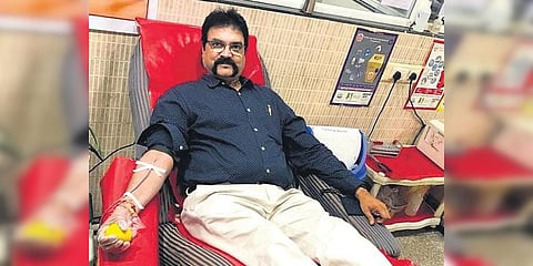K Bhaskar donating blood in Visakhapatnam. (Photo| EPS)