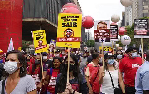 Demonstrators gather during a protest against Brazilian President Jair Bolsonaro, calling for his impeachment. (Photo | AP)