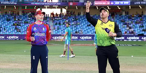 England skipper Eoin Morgan (L) and Australian counterpart Aaron Finch at the toss of a T20 World Cup match in Dubai. (Photo| Twitter)