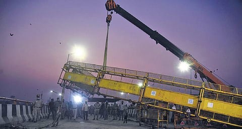 A crane removes barricade