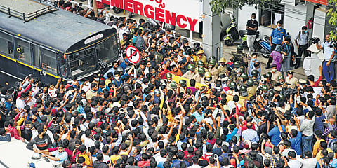 Fans gather outside Vikram Hospital at Vasanth Nagar in Bengaluru after hearing about the untimely death of Power Star Puneeth Rajkumar. (Photo | Vinod Kumar T, EPS)