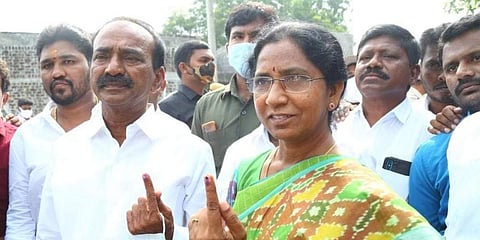 BJP candidate Eatela Rajendra showing ink mark after casting his vote in Huzurabad. (Photo | EPS)