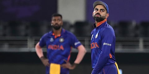 India's captain Virat Kohli reacts to a boundary hit by New Zealand's Daryl Mitchell. (Photo | AP)