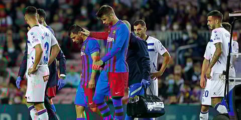 Barcelona's Sergio Aguero and Gerard Pique leave the pitch. (Photo | AP)